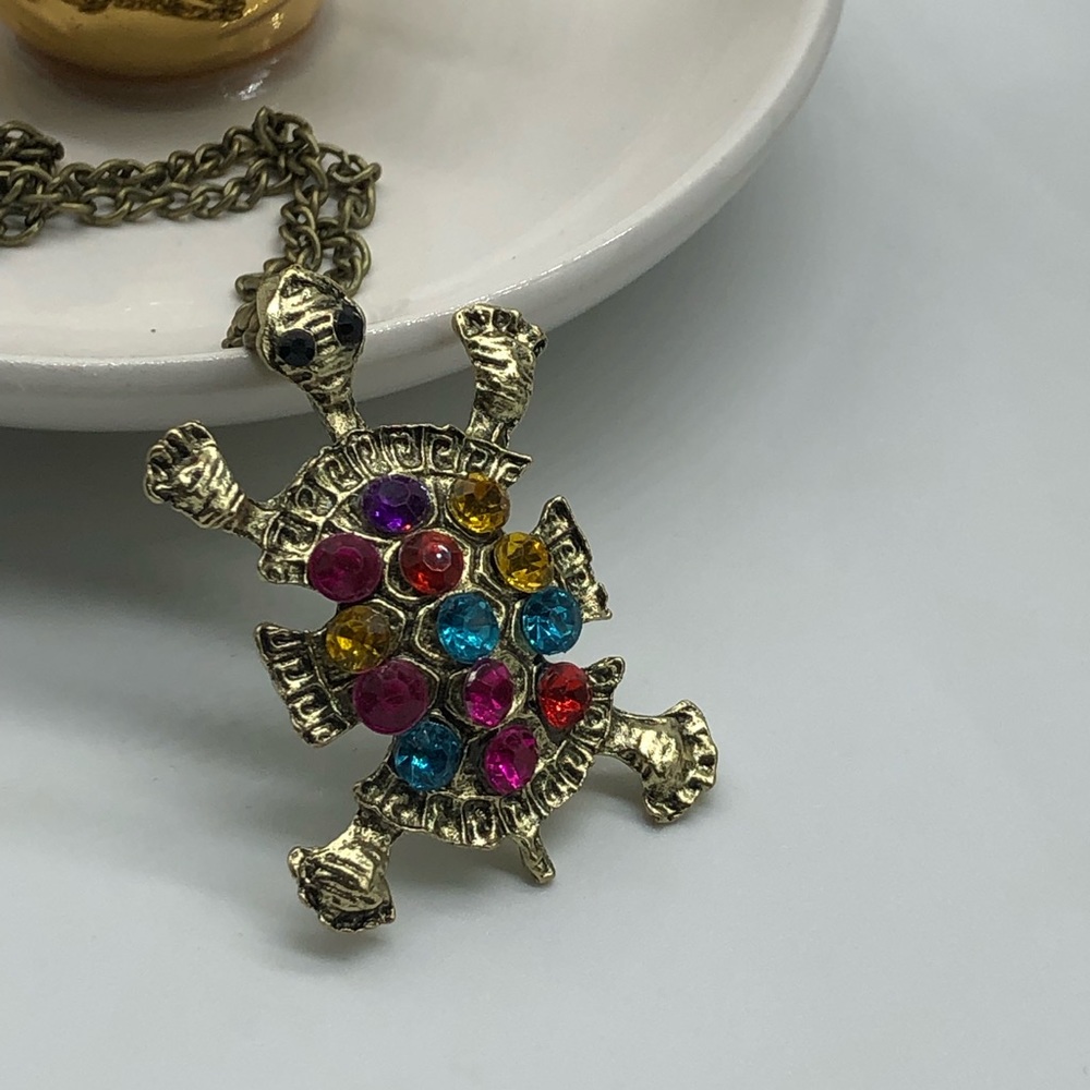 Antique bronze colored long turtle necklace